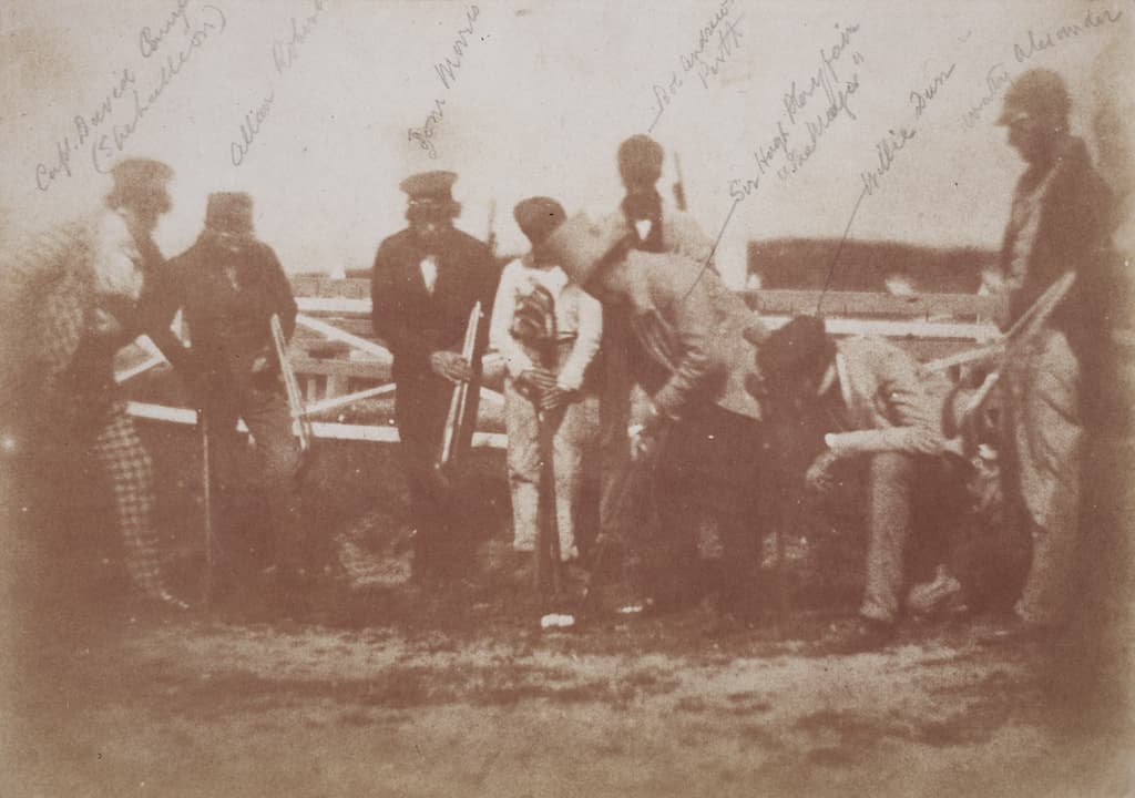 A sepia calotype from the 1840s of golfers at St Andrews holding long-nose clubs, with handwritten name annotations.